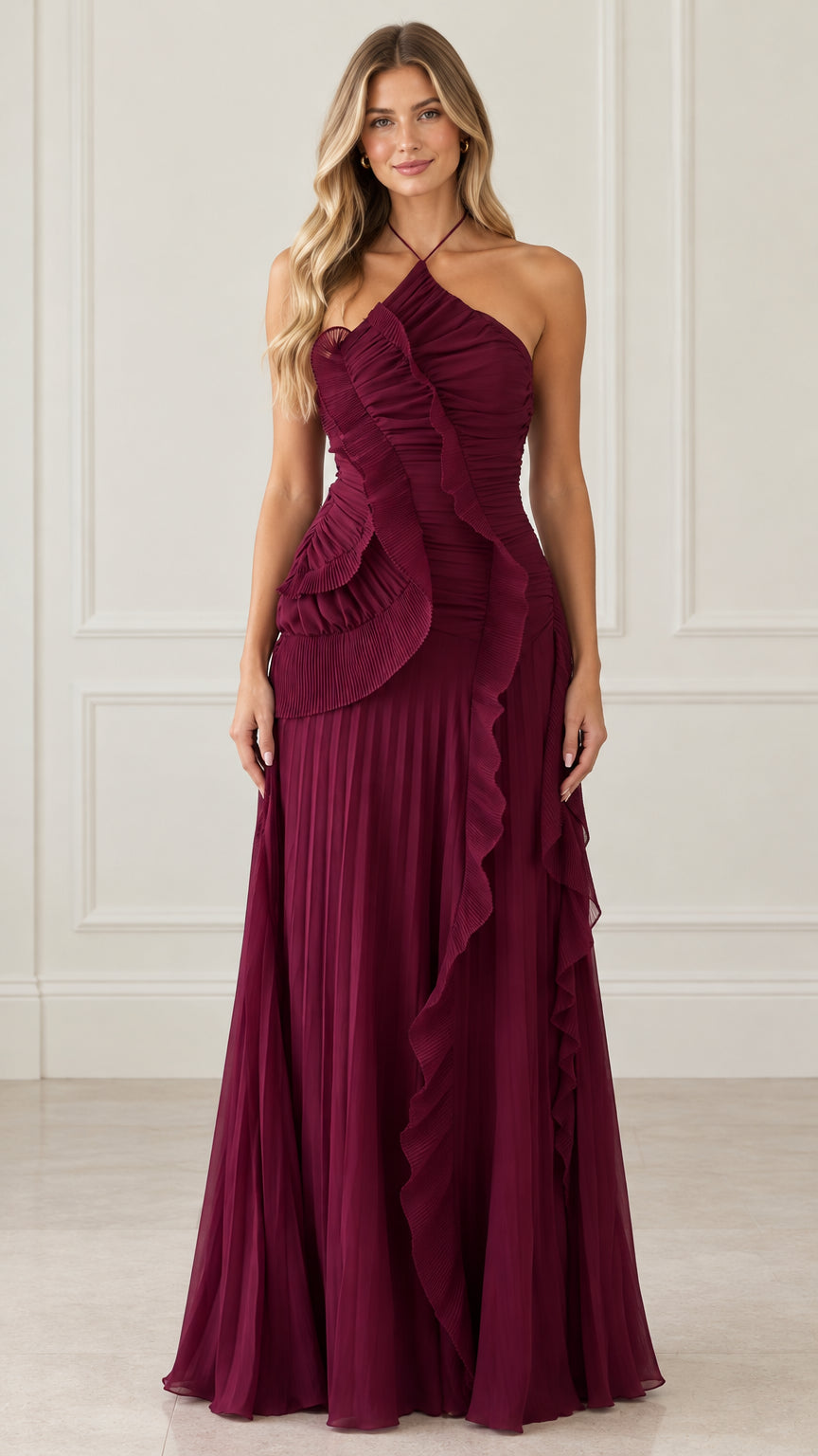 Front view of woman wearing burgundy halter neck pleated ruffle maxi evening gown