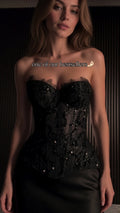 Front view of black strapless beaded corset top with sweetheart neckline