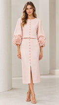 Front view of model wearing Blush Pink two-piece set with floral cuff sleeves and midi pencil skirt