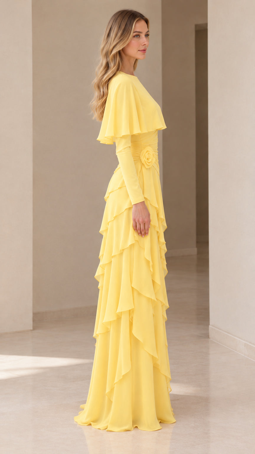 Side profile view of the yellow capelet maxi gown highlighting tiered ruffles and fit