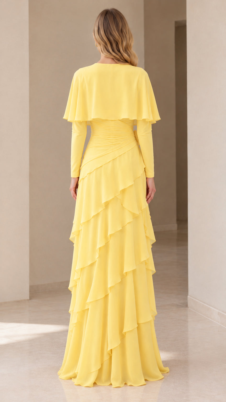 Back full-length view of the yellow long sleeve capelet evening dress