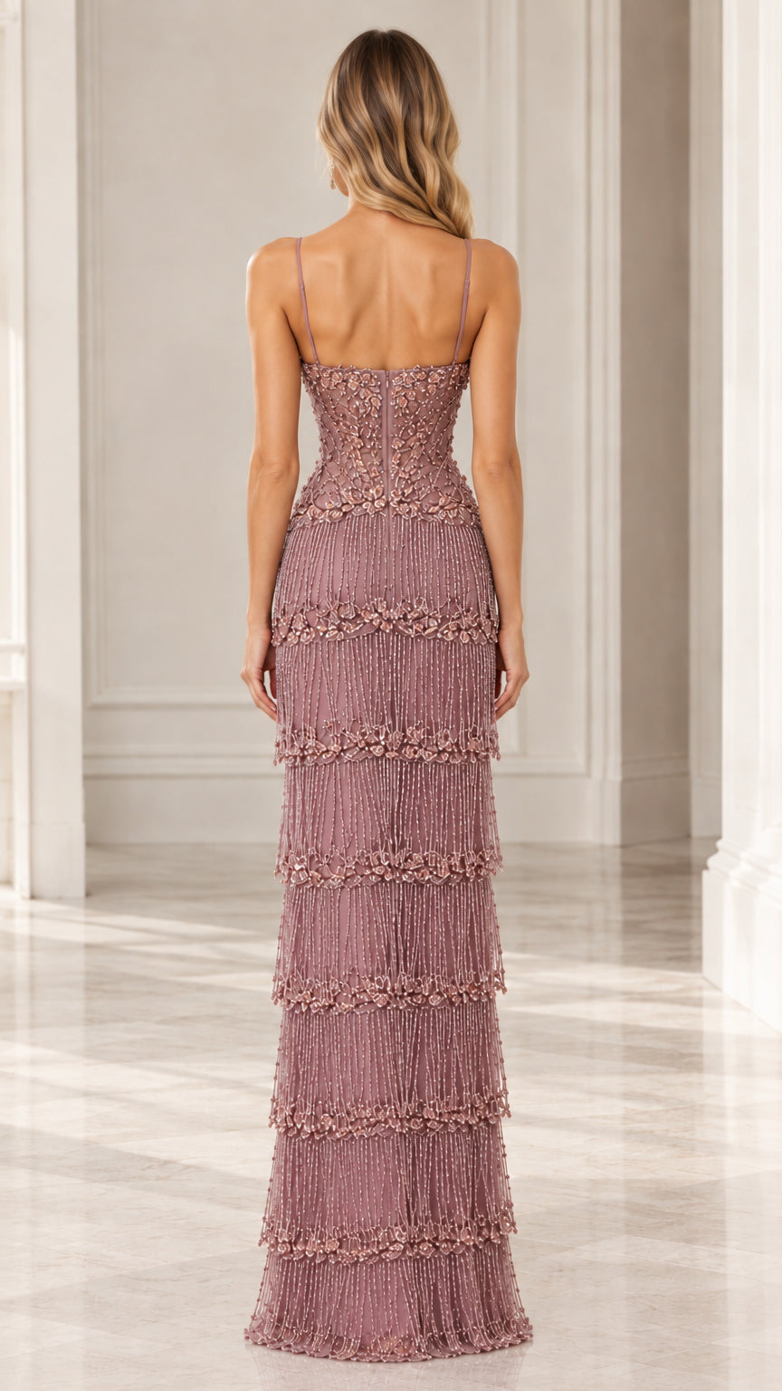 Back view of woman wearing Dusty Rose spaghetti strap floor-length evening gown