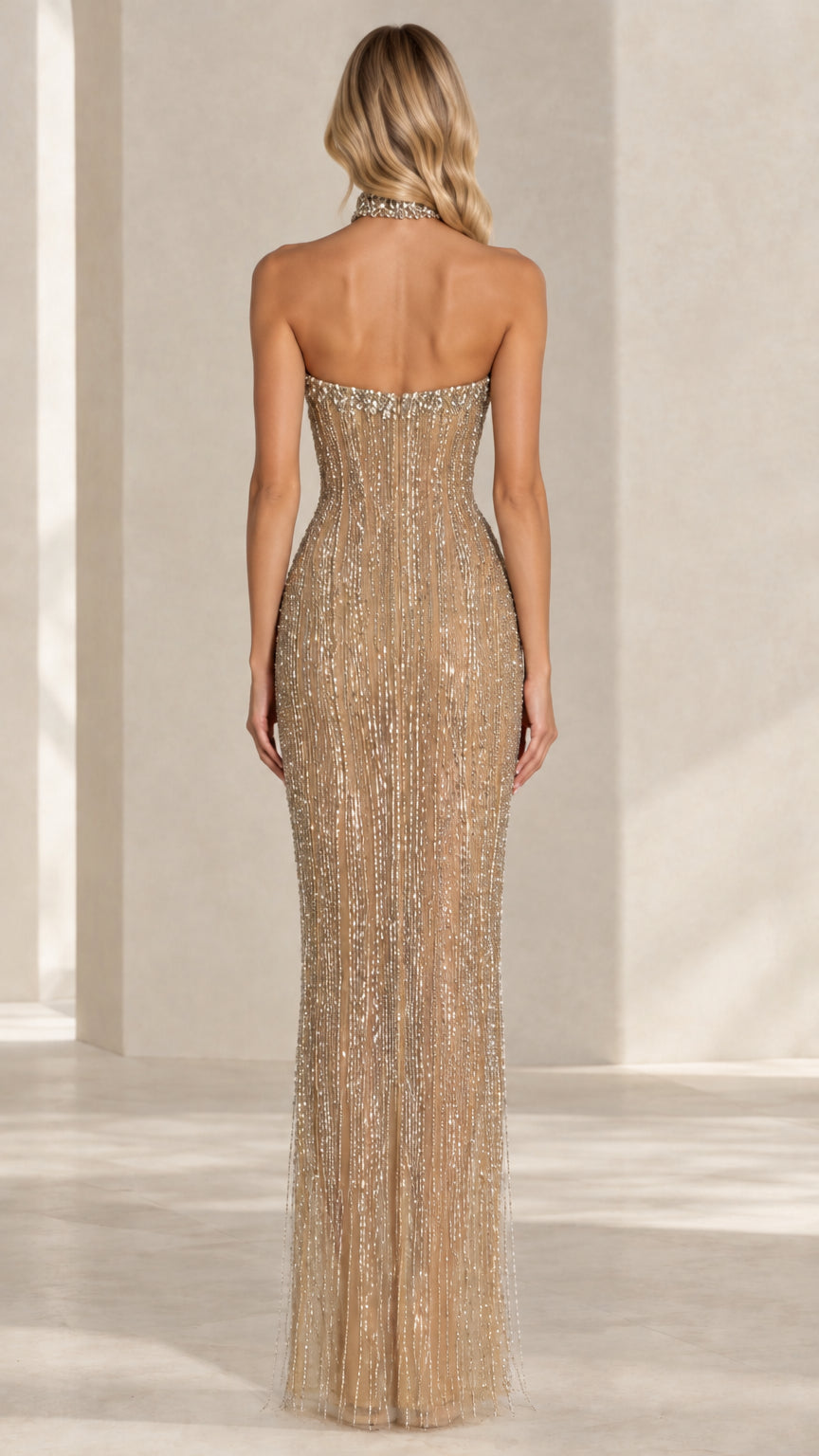 Back view of model in a champagne gold strapless sequin column gown