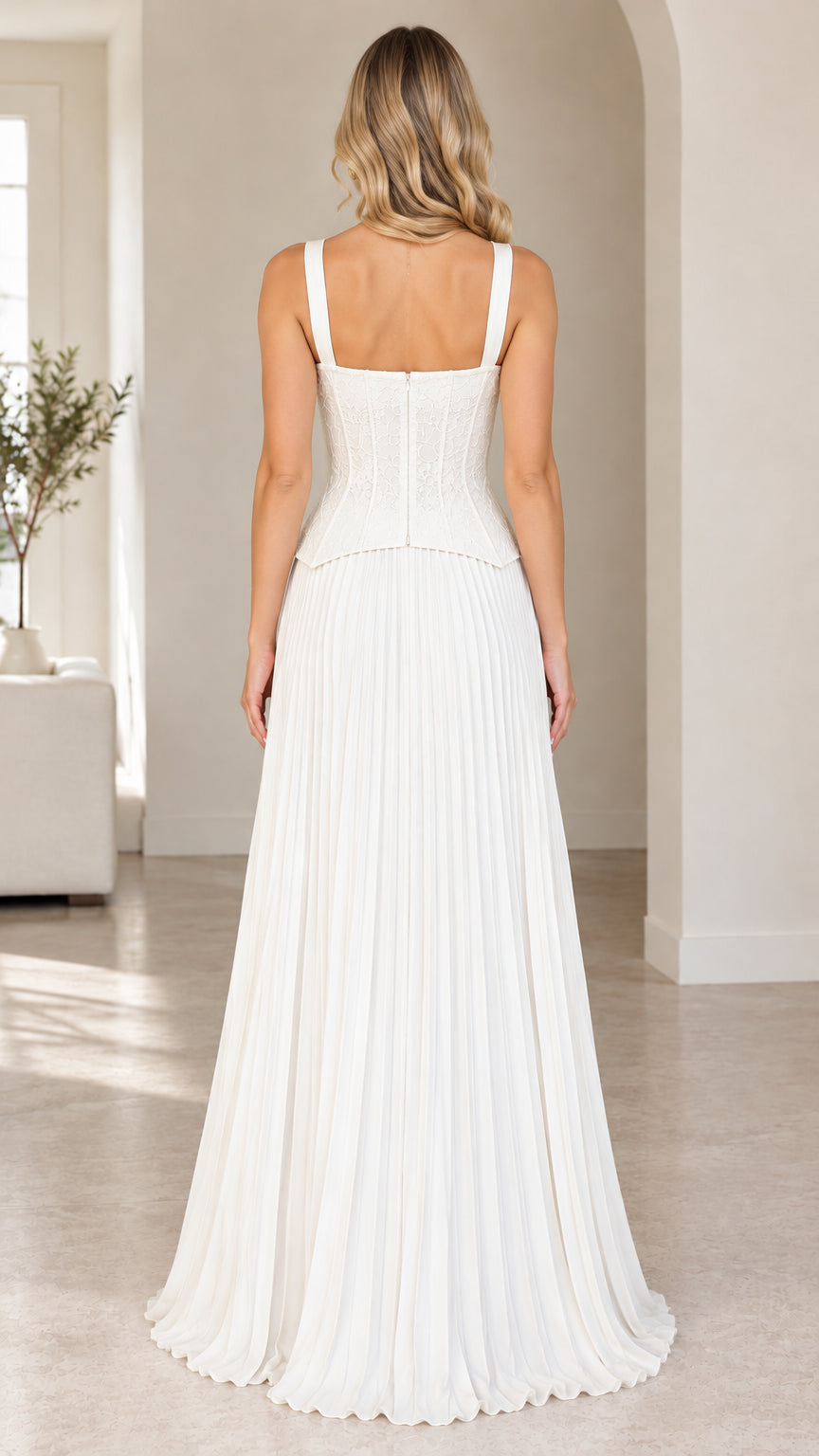 Back view of model wearing white sweetheart corset maxi dress with back zipper