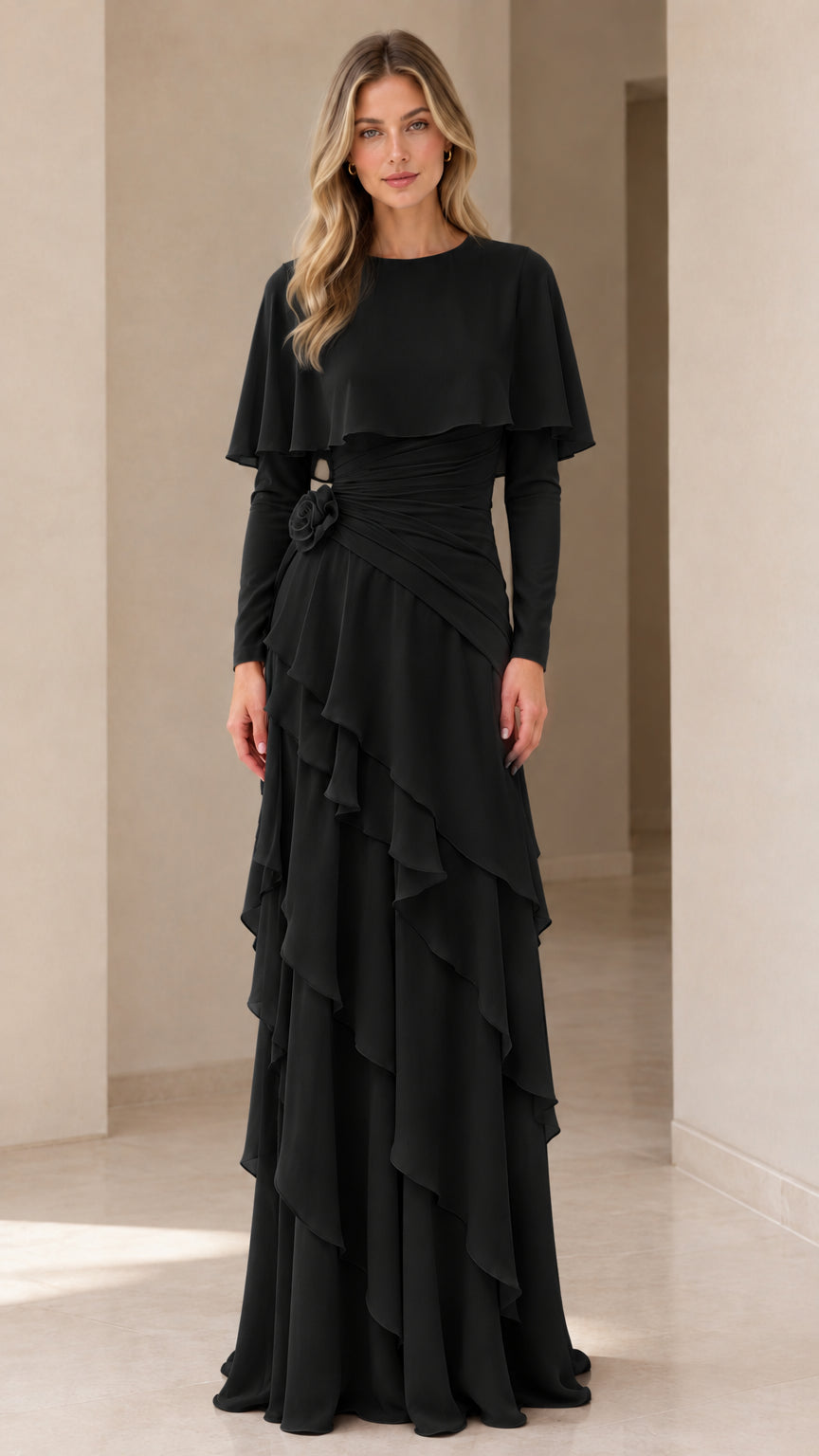 Full-length front view of the long sleeve capelet tiered maxi dress in black