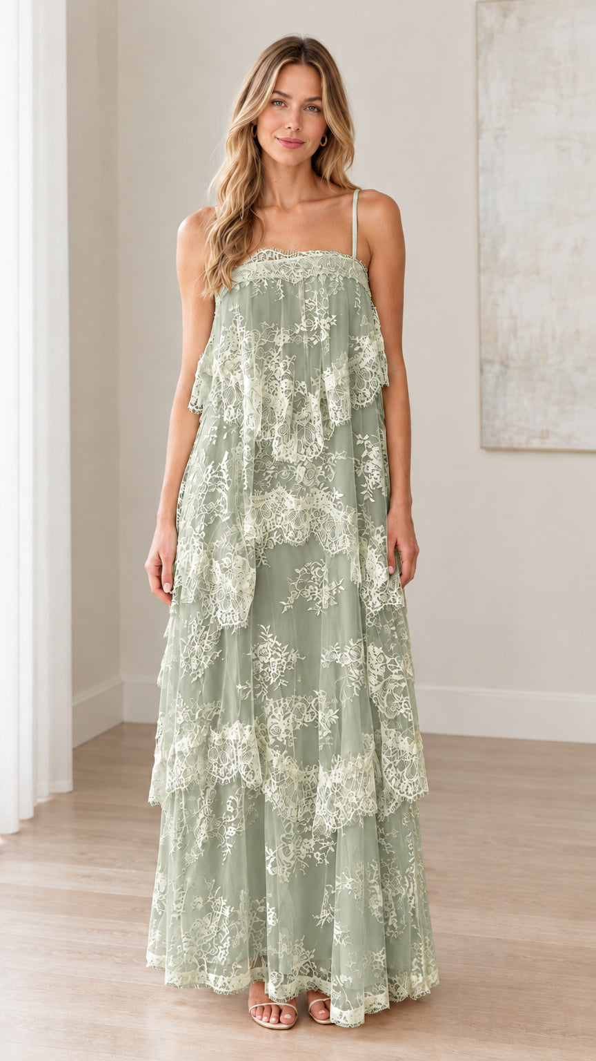Front full-length view of woman wearing sage green tiered floral lace maxi dress