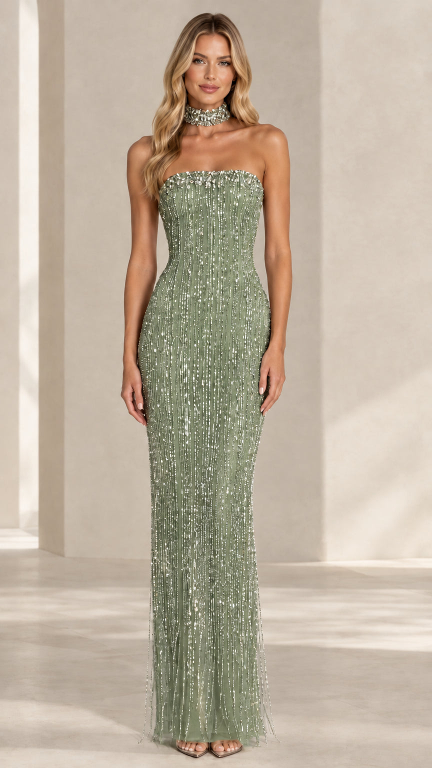 Model wearing a sage green strapless sequin column evening dress with matching neckband