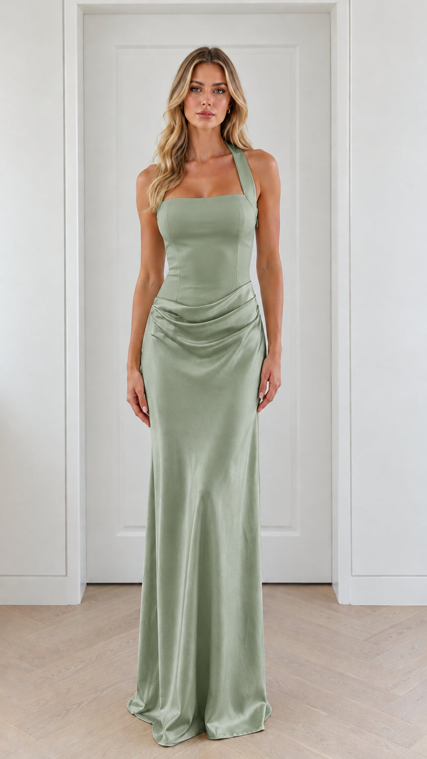 Front view of model wearing sage green halter neck satin evening gown