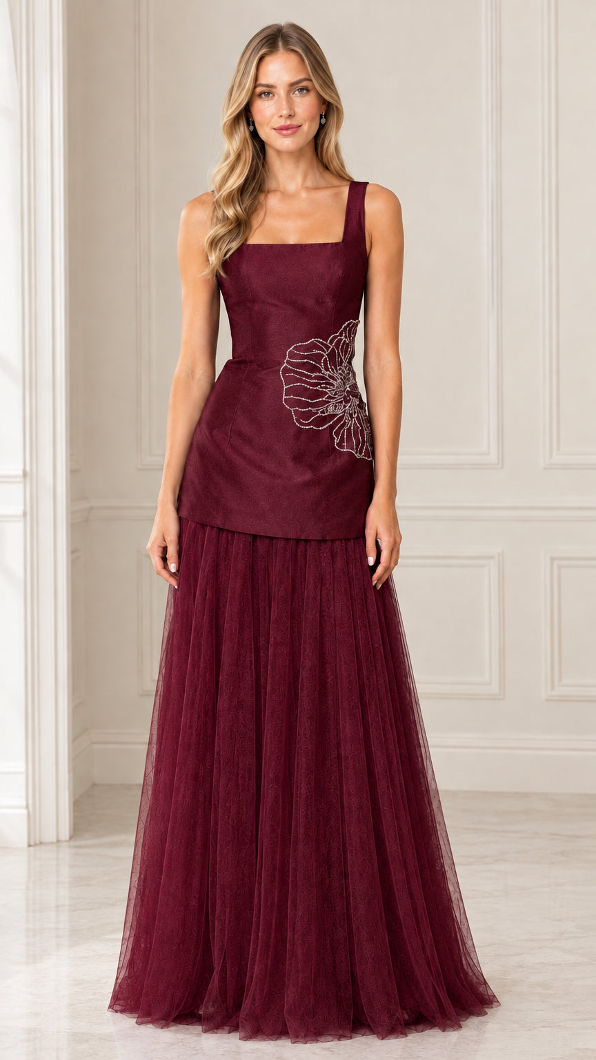 Front view of model wearing Burgundy embroidered drop waist tulle evening gown