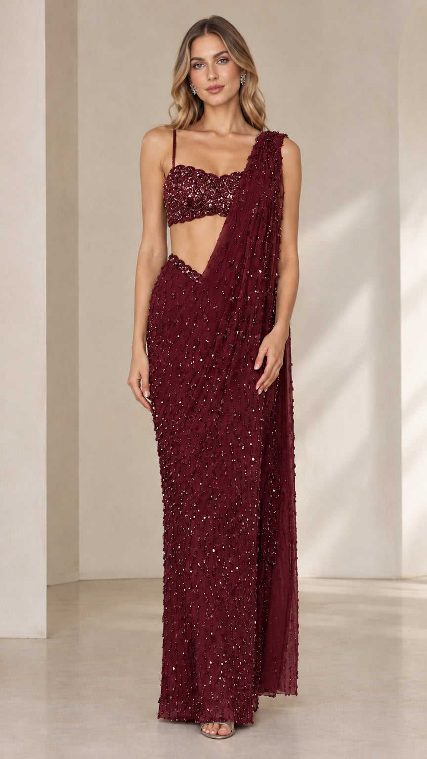Model wearing burgundy wine sequined pre-draped saree gown set